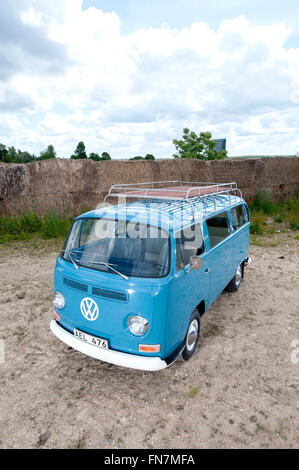 A blue Volkswagen VW type 2 bay camper van with Comic eyes on the ...