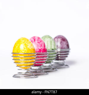 Multicolored chicken eggs in egg holder Stock Photo