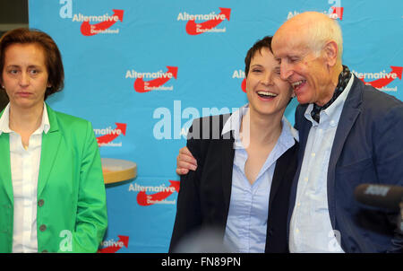 Berlin, Germany. 13th Mar, 2016. The chairwoman of the Alternative for Germany (AfD), Frauke Petry (C) and the vice-federal spokesperson Albrecht Glaser smiles after the first results of the state parliament elections in Saxony-Anhalt, Rhineland-Palatinate and Baden-Wuerttemberg during the election party in Berlin, Germany, 13 March 2016. The deputy chairwoman Beatrix von Storch stands on the left. Photo: Wolfgang Kumm/dpa/Alamy Live News Stock Photo