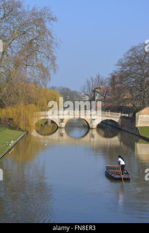 Punting on the River Cam along The Backs towards Clare Bridge, University of Cambridge, England.