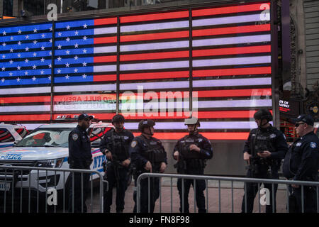 Swat Team in front of the American Flag on the U.S. Recruiting Station, Times Square, NYC Stock Photo