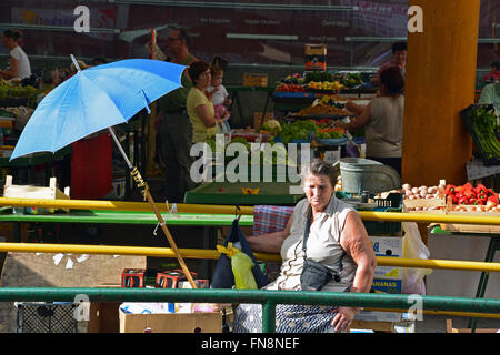 Vendors sell produce in the Green Market in the Old Town section of Sarajevo, Bosnia and Herzegovina. Stock Photo