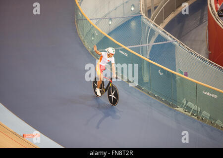 Chinese athlete,Guihua Liang wins gold medal in C2 individual pursuit in velodrome during Paralympics,London,2012,England,UK. Stock Photo