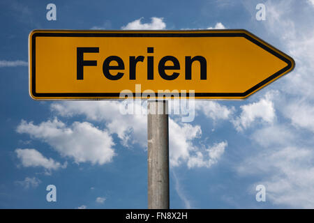 Detail photo of a signpost with the German title Ferien (holiday) Stock Photo
