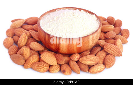 Fresh almonds with flour over white background Stock Photo