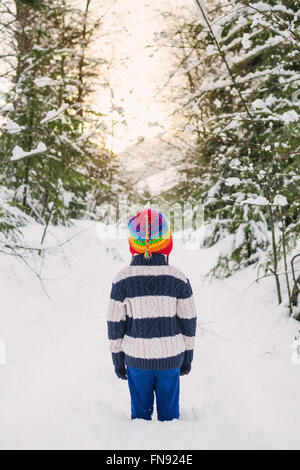 Boy standing in snow Stock Photo