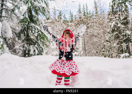 Girl throwing snow in the air Stock Photo