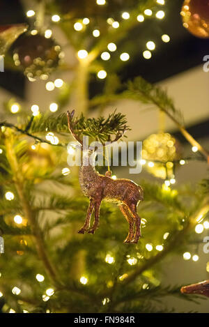Christmas decorations. A traditional real Christmas tree, decorated with lights. Stock Photo