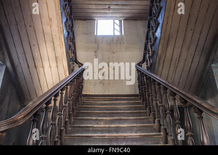 old wooden staircase railing. handrails, balusters and stair old wooden stairs Stock Photo