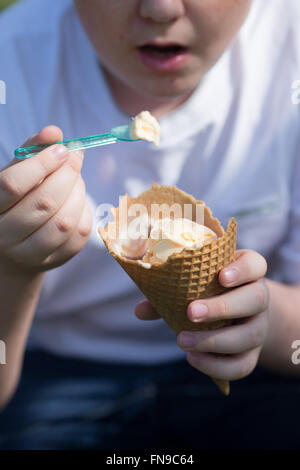 Boy eating ice-cream cone Stock Photo