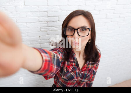 Young Beautiful Girl Taking Selfie Picture With Duck Face Lips Smart Phone Photo Camera Stock Photo