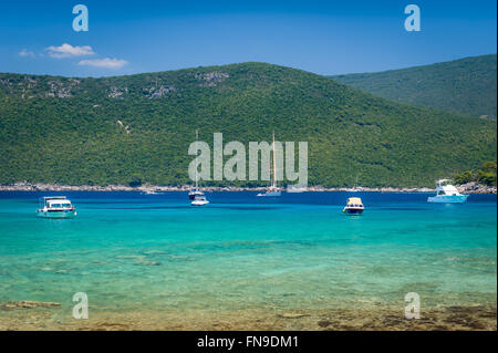 Recreational boats and yachts at anchor in a beautiful calm bay with dreamy water Stock Photo