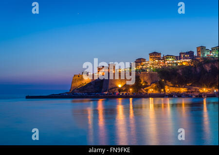 Ulcinj old town fortress at night with silky water and stars on a sky. Stock Photo