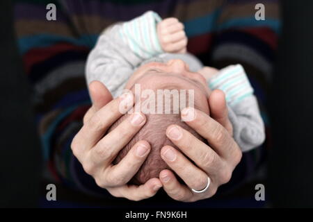 Father holding newborn baby boy Stock Photo