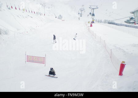 Three men snowboarding, Sierra Nevada, Granada, Spain Stock Photo