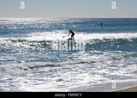 Stand up paddle surfing or standup paddleboarding Stock Photo