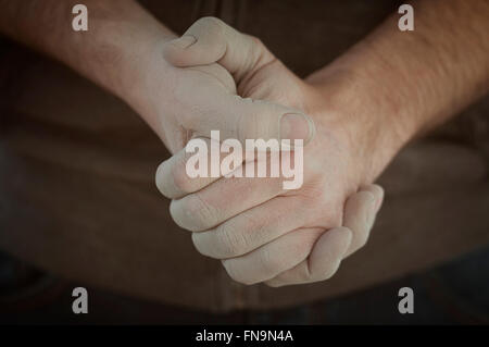 Close up of man's hands clasped Stock Photo