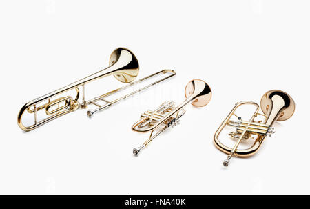 Set of brass musical instruments on a white background, include trumpet, trombone, flugelhorn and french horn Stock Photo