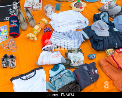 Display of used goods on flea market on King's Day in the Netherlands Stock Photo