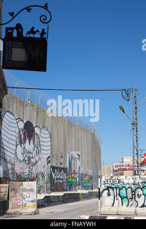 BETHLEHEM, ISRAEL - MARCH 6, 2015: The graffiti on the Separation barrier. Stock Photo