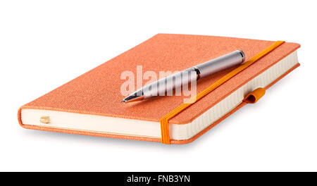 Orange closed diary with pen isolated on white background Stock Photo
