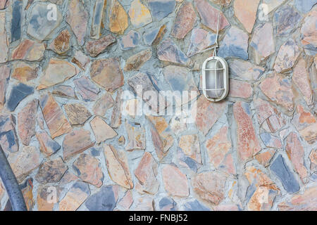 Classic white lantern on the red tiles wall. Stock Photo