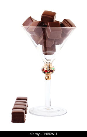 Martini glass filled with chocolate truffles isolated on white. Stock Photo