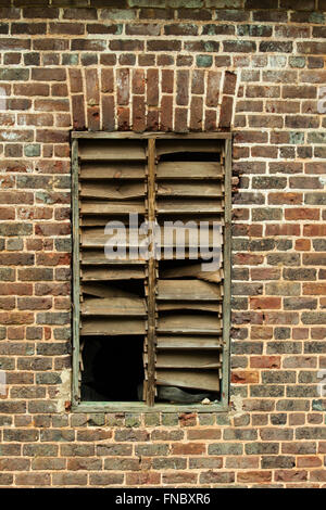 Brick wall window opening in a very old building. Stock Photo