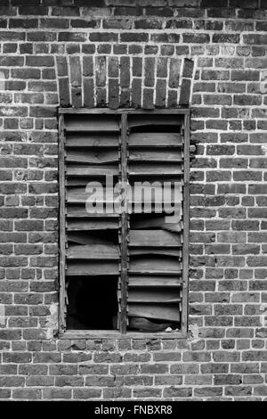 Brick wall window opening in a very old building. Stock Photo