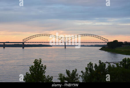 Sunset over the I-40 bridge over the Mississippi River leading to downtown Memphis Tennessee. Stock Photo