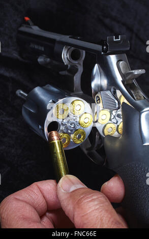 Man Loading Magnum Revolver Gun closeup Stock Photo - Alamy