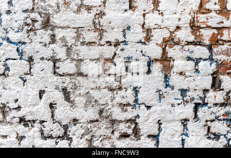 Old weathered white brick wall as background Stock Photo