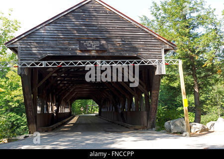 A traditional covered bridge over the Swift River, Albany, New Hampshire, USA Stock Photo