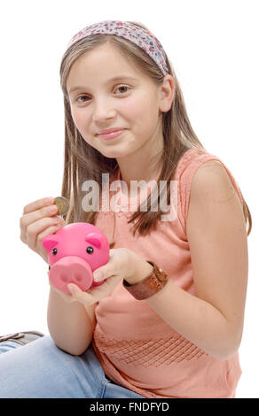 a preteen with a piggy bank, on white Stock Photo