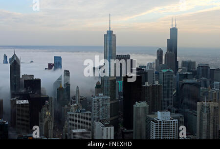 Downtown Chicago skyline as fog comes in off of Lake Michigan seen from the 360 Chicago observatory in the John Hancock Center Stock Photo