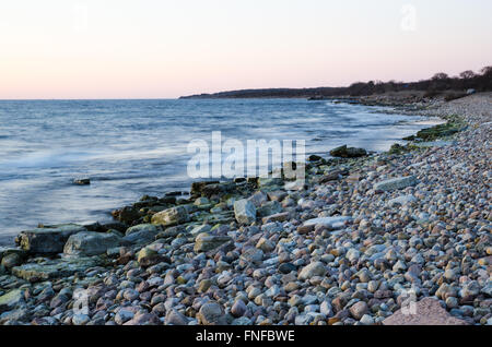 Evening light by the stony coast of the Swedish island Oland in the Baltic Sea Stock Photo