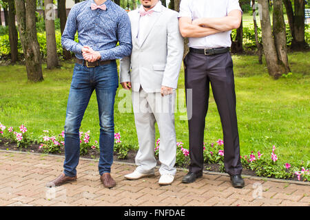 Three friends, groom with groomsman having fun Stock Photo