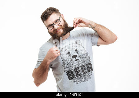 Funny cheerful bearded man standing and having fun over white background Stock Photo