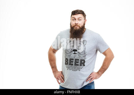 Handsome bearded man standing and staring in camera with rebuke over white background Stock Photo