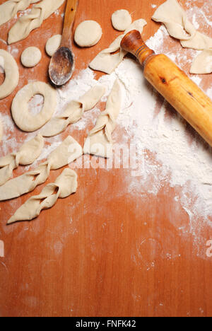 Shape of dough on the table, flour the rolling pin, copy space Stock Photo