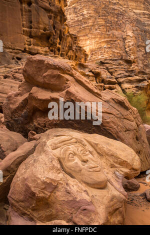 Petroglyphs in the rock in the Wadi Rum desert of southern Hashemite Kingdom of Jordan, Middle East. Stock Photo