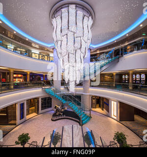 Central atrium with colour changing chandelier and glass staircase ...