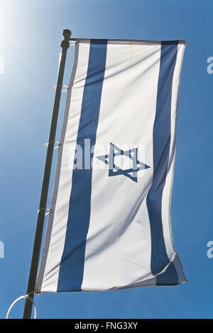 Flag of Israel against blue sky Stock Photo