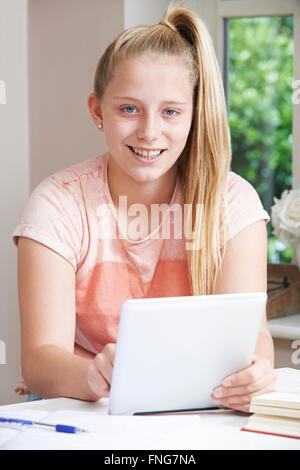 Portrait Of Girl Using Digital Tablet At Home Stock Photo