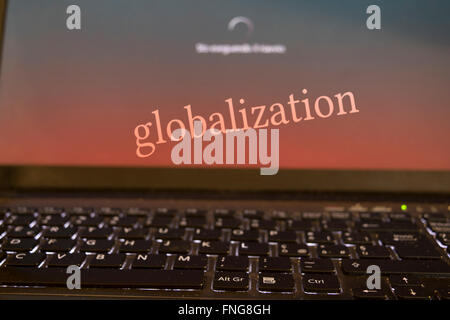 concept of globalizatione and modern technologies with a writen on the desktop of the a computer Stock Photo