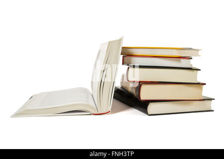 High books stack with open book isolated on white background. Many colorful book covers. Stock Photo