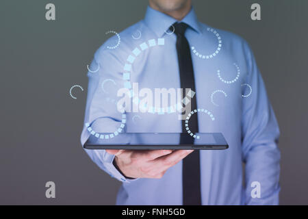 businessman hand touch  gear to success as concept. Business man using tablet PC. Stock Photo