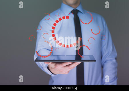 businessman hand touch  gear to success as concept. Business man using tablet PC. Stock Photo
