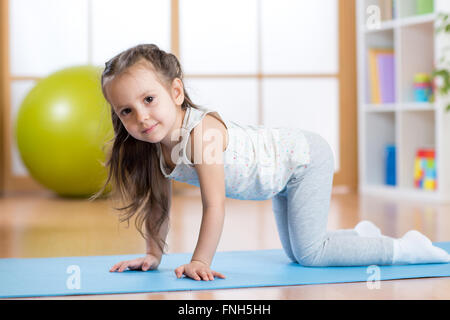 kid girl doing gymnastics Stock Photo