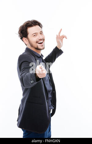 Cheerful businessman pointing at camera isolated on a white background Stock Photo